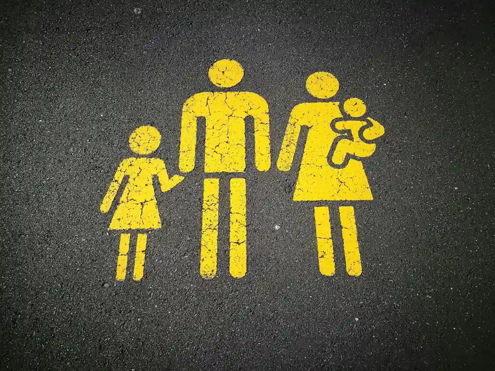 Concrete With a Family Painted On It In Yellow